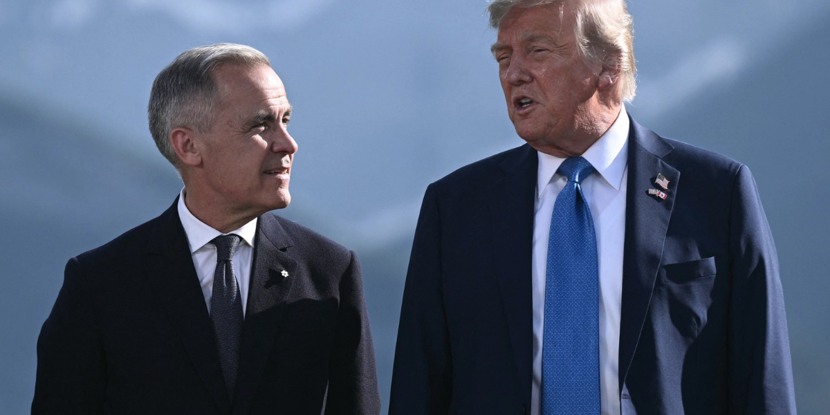 US President Donald Trump and Canadian Prime Minister Mark Carney speak during a meeting amid rising trade tensions and new 50% tariffs on Canada.