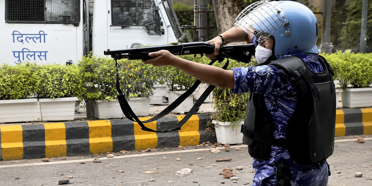 RAF pellet gun Delhi protest personnel aiming anti-riot gun